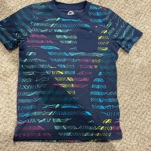 Wonder Nation size 6/7 t-shirt with a small pocket, navy with multi color design